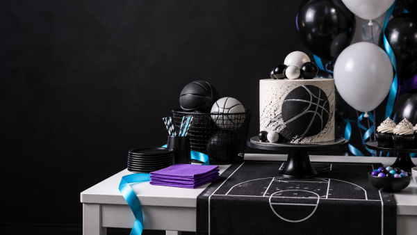 Basketball party concept with monochrome cake and cyan and violet decorations